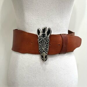 Anthropologie wide brown leather belt with a large silver zebra head buckle M
